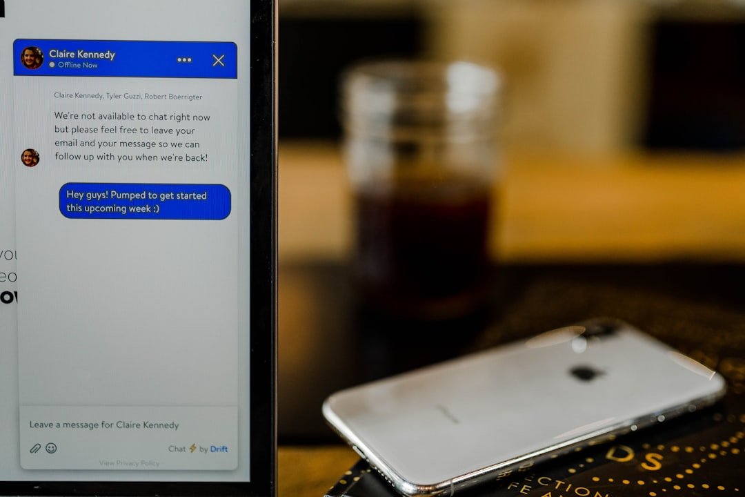 Person reviewing an app on a phone and laptop, representing checking an app's pricing and reviews