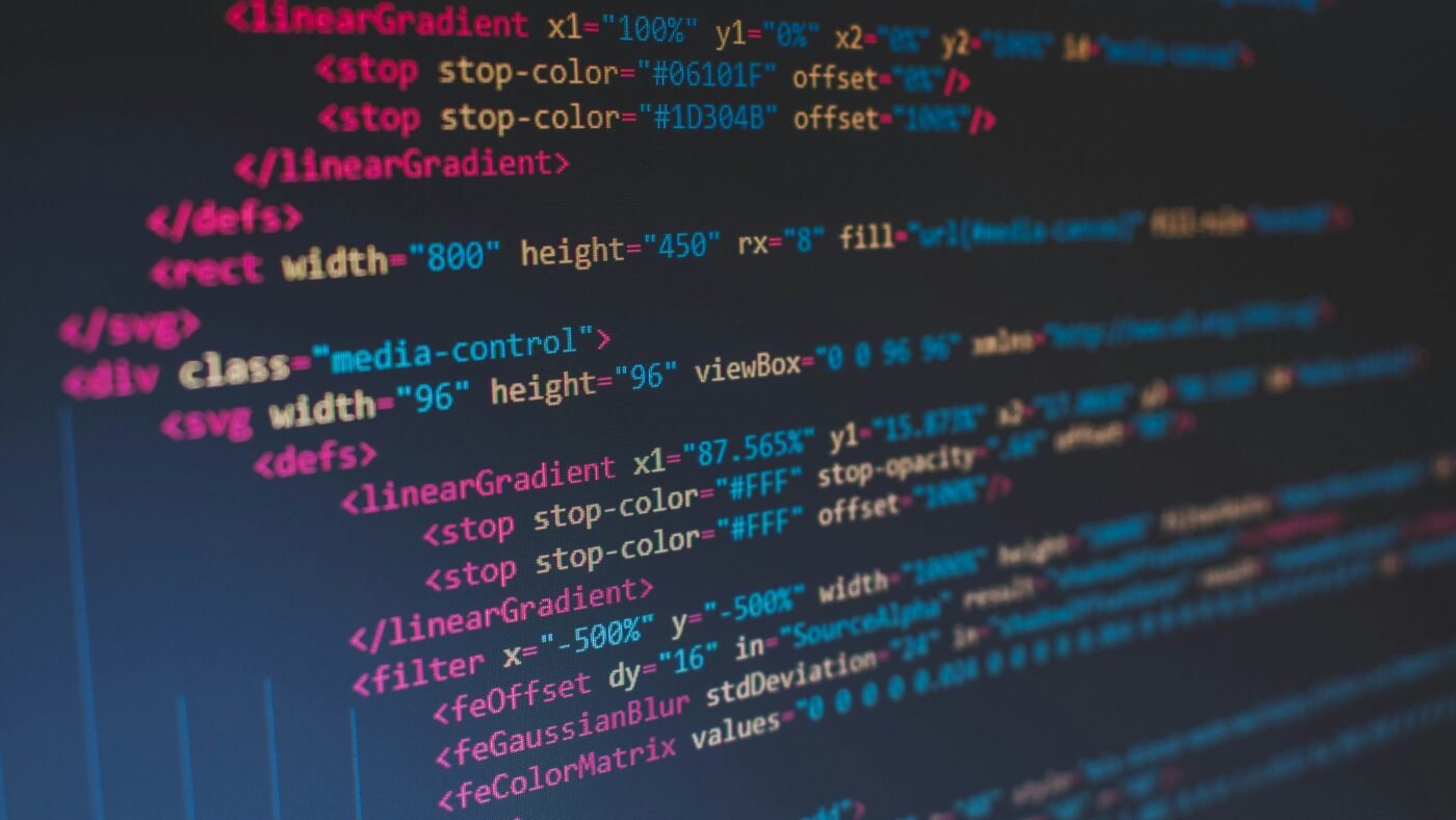 Developer working on a laptop with code on screen, representing AI powered app building