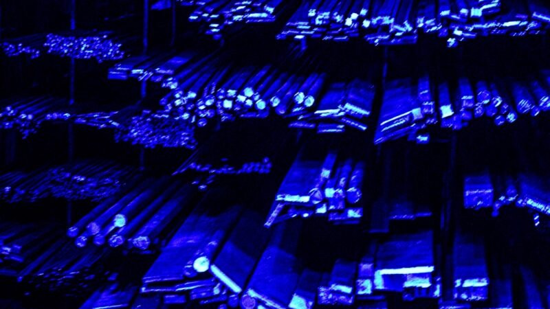 Data center server racks glowing with blue light, representing AI cloud infrastructure