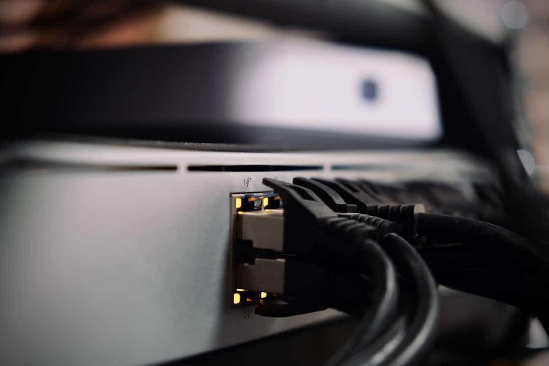 Network switch with cables representing the data center networking hardware Cornelis builds