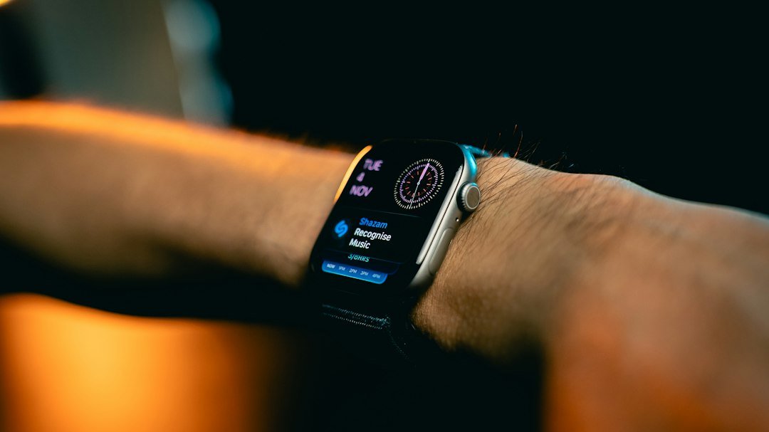 Close-up of an Apple Watch on a wrist, representing the Taptic Engine haptic feedback at the center of the patent case