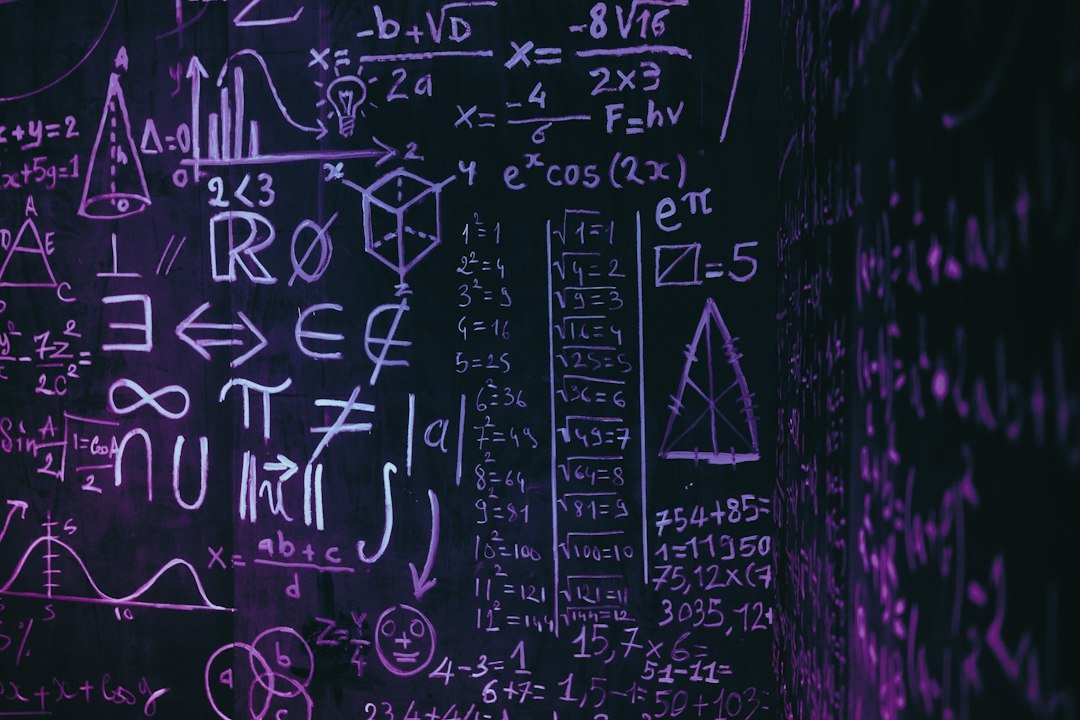 Blackboard covered in complex mathematical formulas and symbols, illustrating unsolved math problems