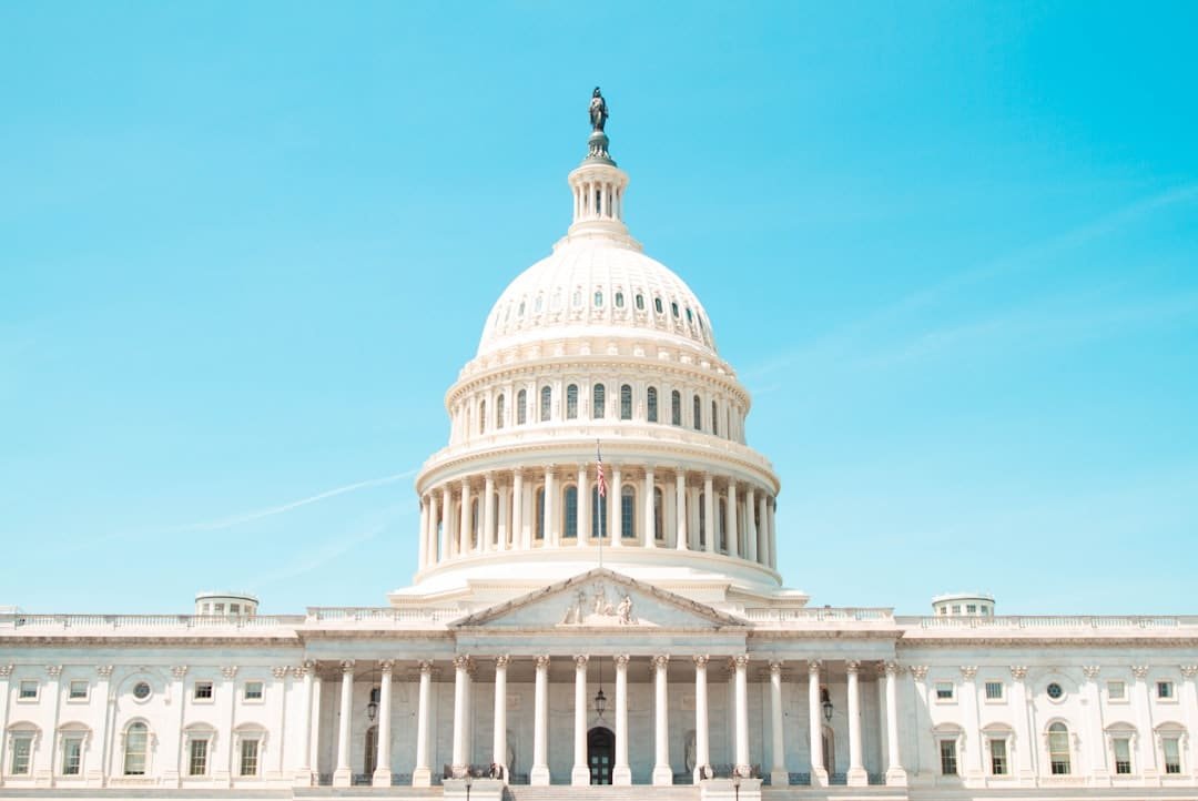 Capitol Hill dome viewed against a clear sky, representing federal policy debate