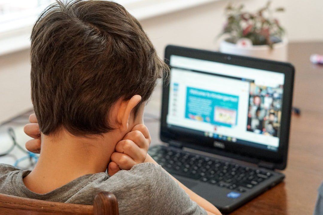 Young student on a laptop video call, representing online 1-on-1 tutoring