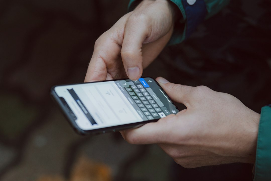 Close-up of a person scrolling a smartphone screen, representing the download race between competing AI apps