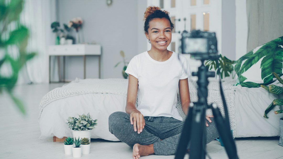 Social media content creator recording a video on a smartphone