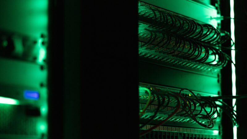 Data center server racks with blue ambient lighting representing the growing server chip market