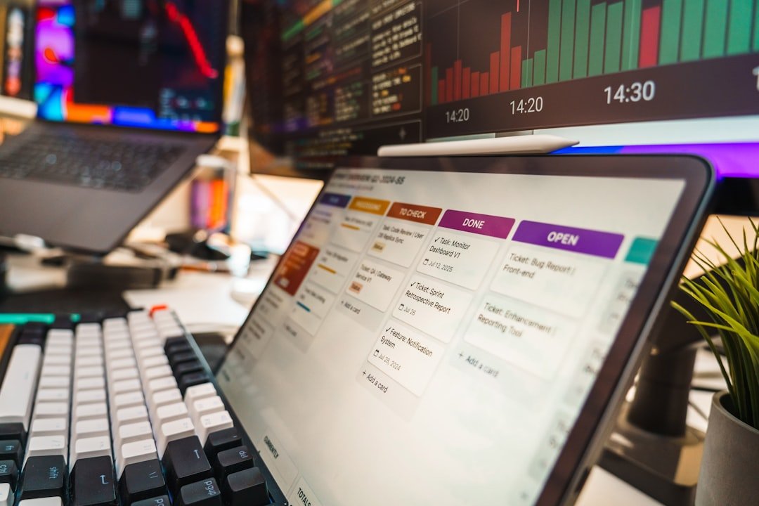 Software developer workspace with mechanical keyboard and task board