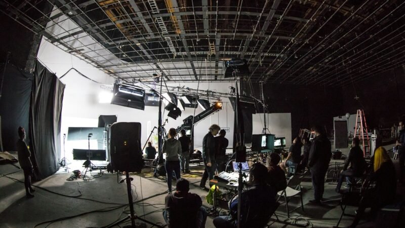Film production set with cinema camera, representing documentary filmmaking