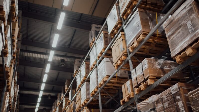 Warehouse shelving stacked with cardboard boxes at an ecommerce fulfillment center