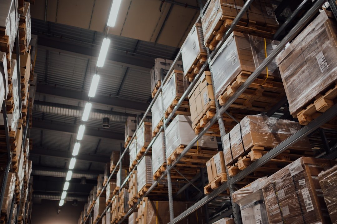 Warehouse shelving stacked with cardboard boxes at an ecommerce fulfillment center