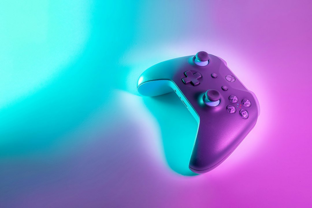 Video game controller lit by neon light, representing Minecraft's expansion across consoles