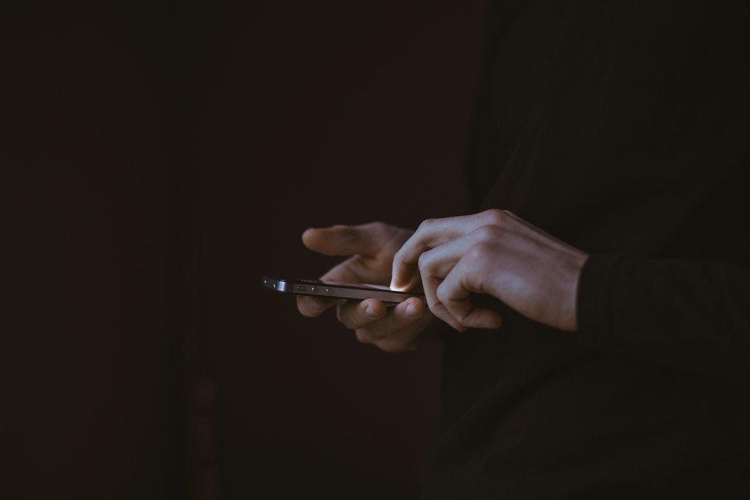 Person holding a smartphone up to make a call