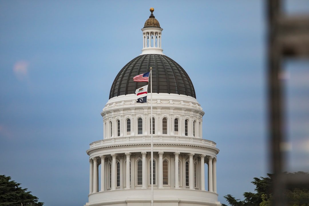 Government building facade with a flag, representing state legislation