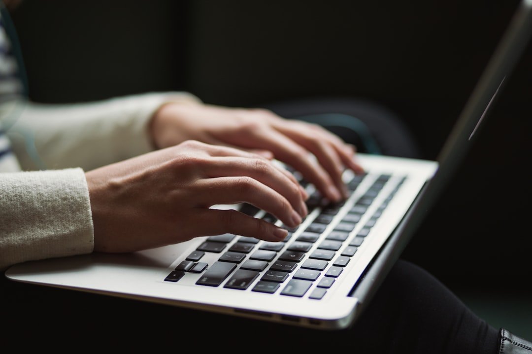 Person using a laptop at night, representing AI chatbot demand