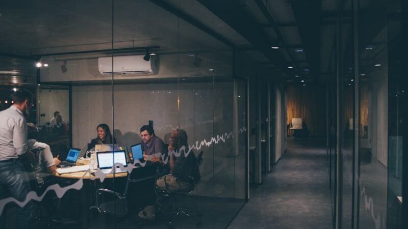 Group of people in a startup meeting, representing AI agent company Manus raising new funding