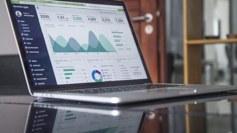 Marketing analytics displayed on a laptop screen, representing the shift toward conversational AI advertising
