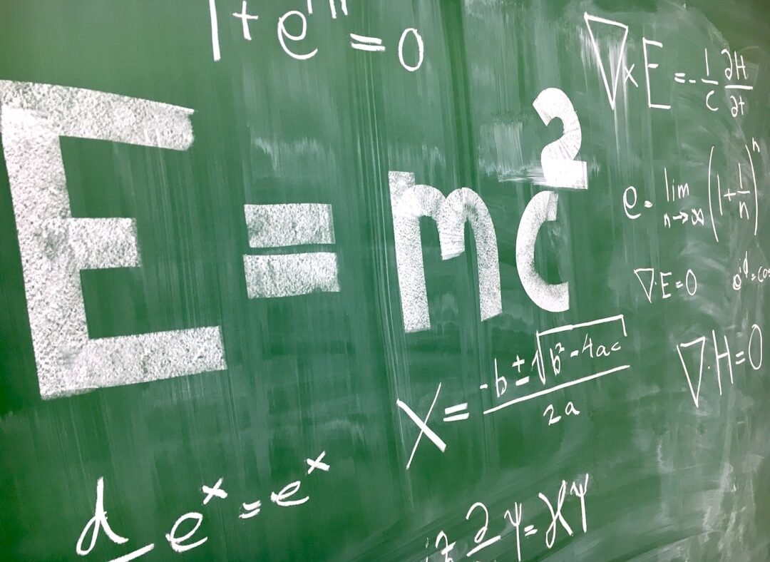 Complex math equations written on a chalkboard, representing OpenAI's claimed progress on open math problems