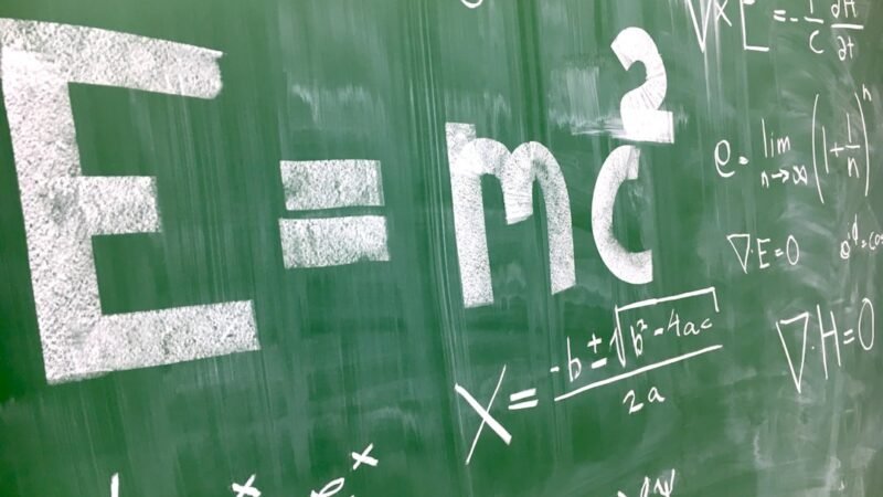 Complex math equations written on a chalkboard, representing OpenAI's claimed progress on open math problems