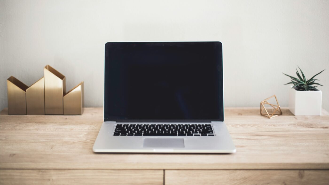 Modern laptop on a desk, representing Microsoft's upcoming Surface and Windows local AI event