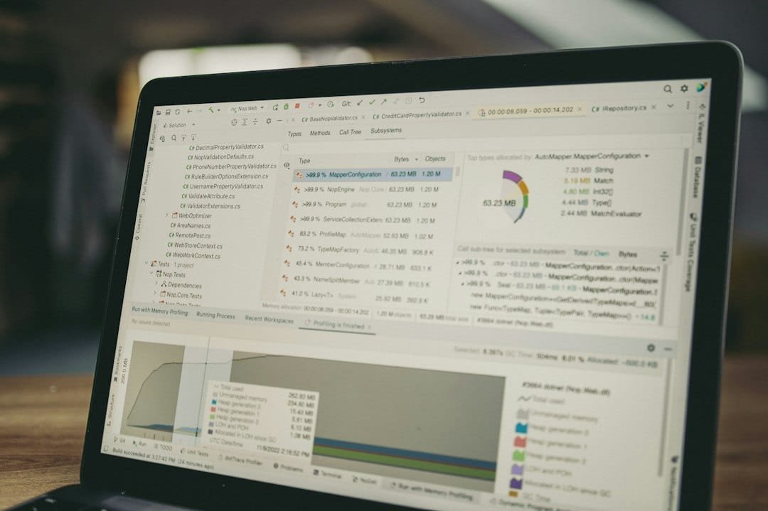 A laptop screen displaying analytics charts and data graphs