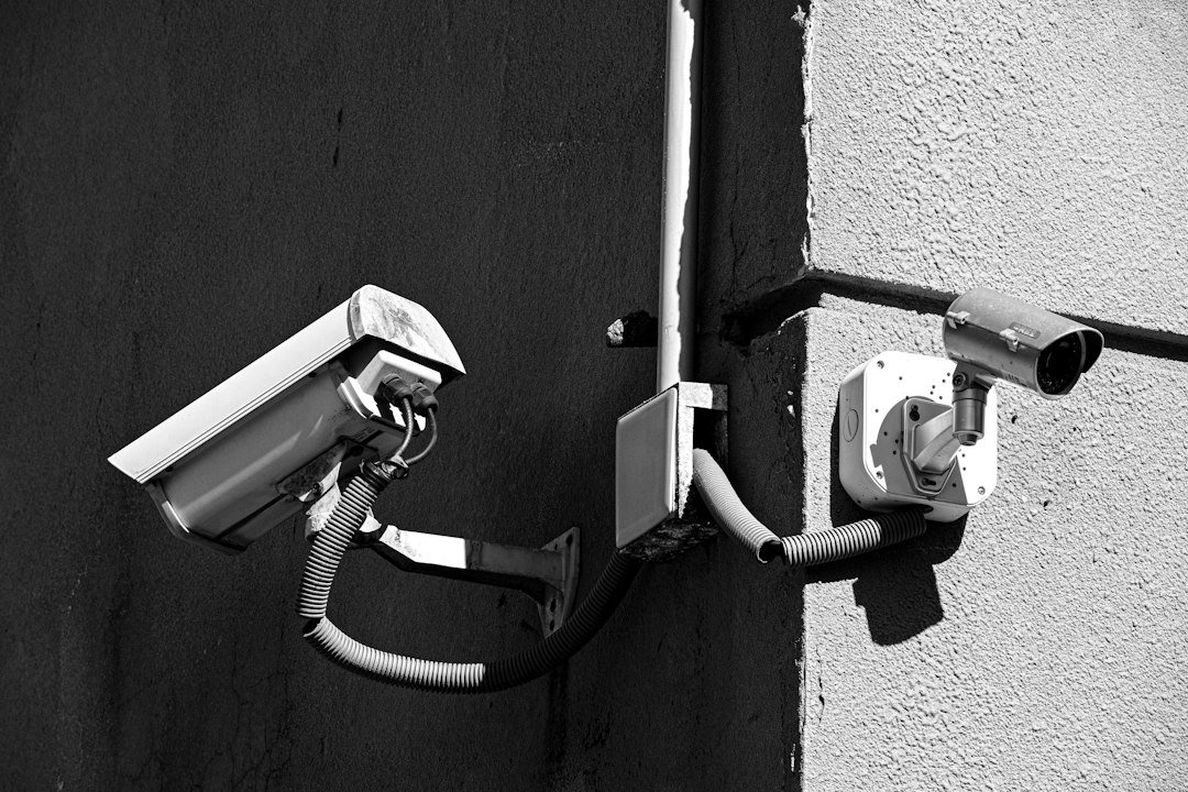 Closeup of security camera surveillance hardware mounted outdoors
