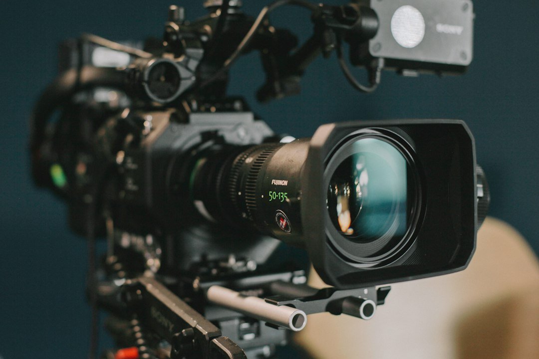 A professional shoulder-mount film camera, symbolizing the film production commitments in the Paramount settlement