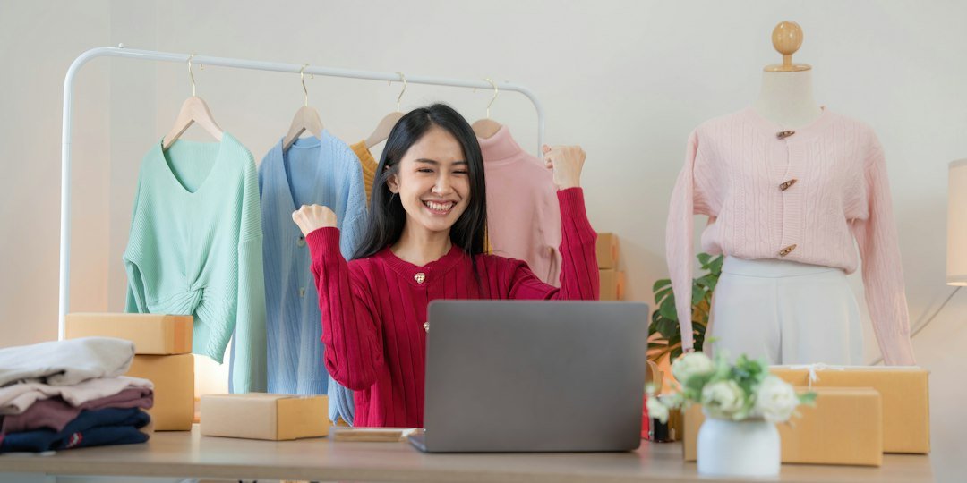 Small business owner working on a laptop managing her online store