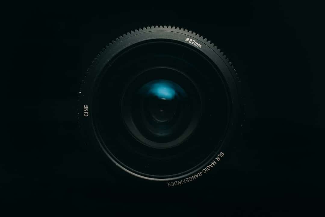 Smartphone camera lens close-up, representing OpenAI's acquisition of camera technology startup Glass Imaging