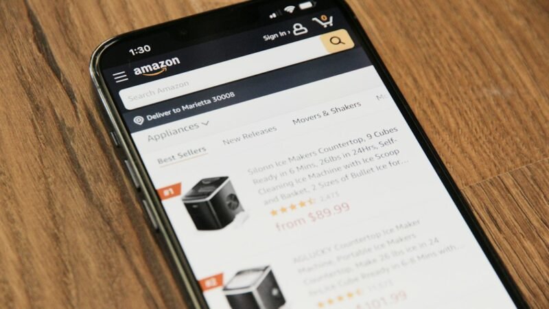 A smartphone on a table representing online shopping, illustrating Amazon blocking Meta's AI shopping agent