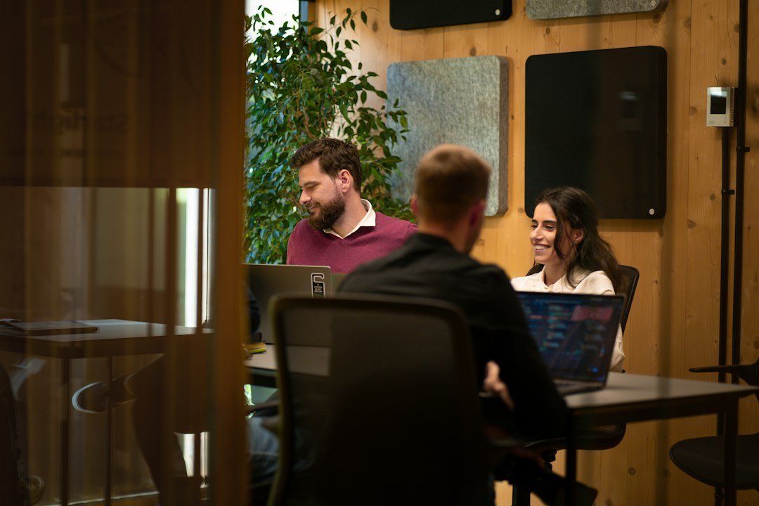 Programmers working together in a modern startup meeting room