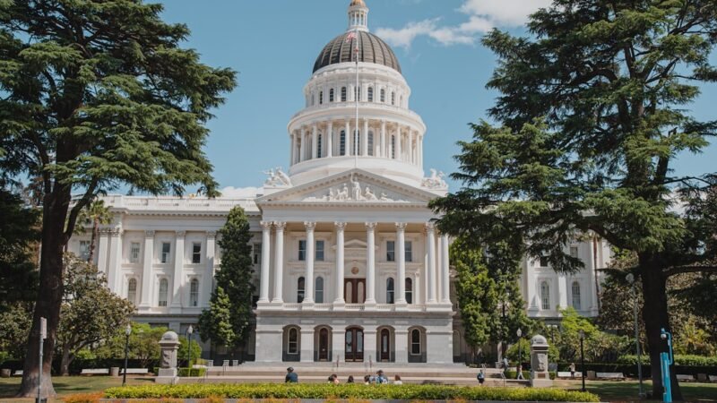 White government building with a dome, representing state capitol architecture