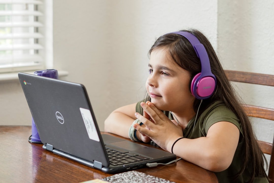 Elementary student wearing headphones during a remote learning session