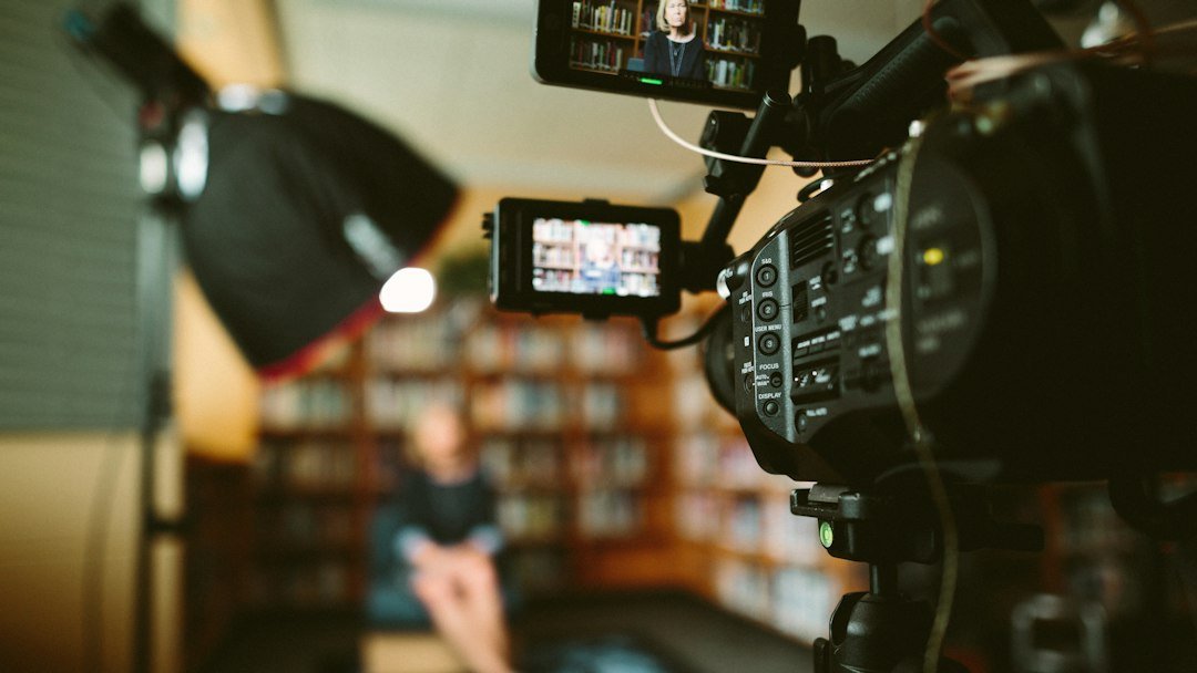 Cinema camera set up for a filmed interview under studio lighting