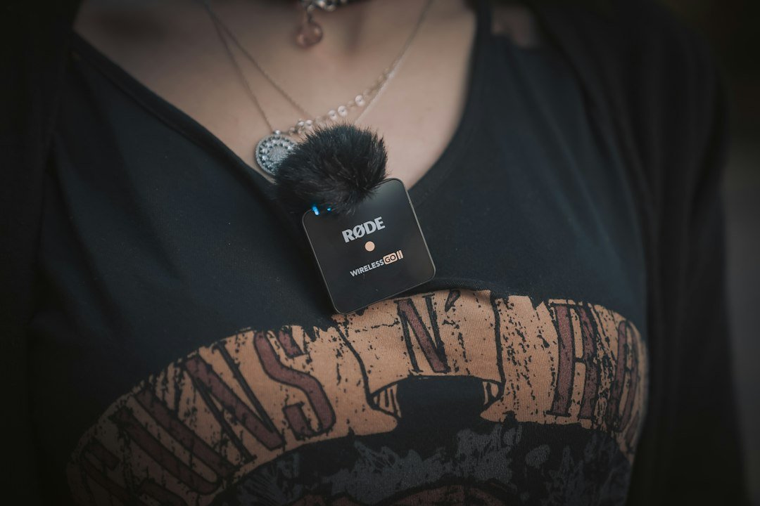 Small clip-on wearable recording device, representing AI wearable pendants and recorders