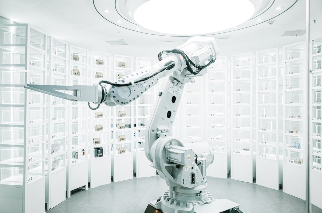 White robotic arm displayed in a technology showroom
