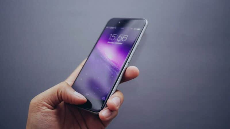 Smartphone lock screen close-up, representing Apple's iOS 27 update with a rebuilt Siri
