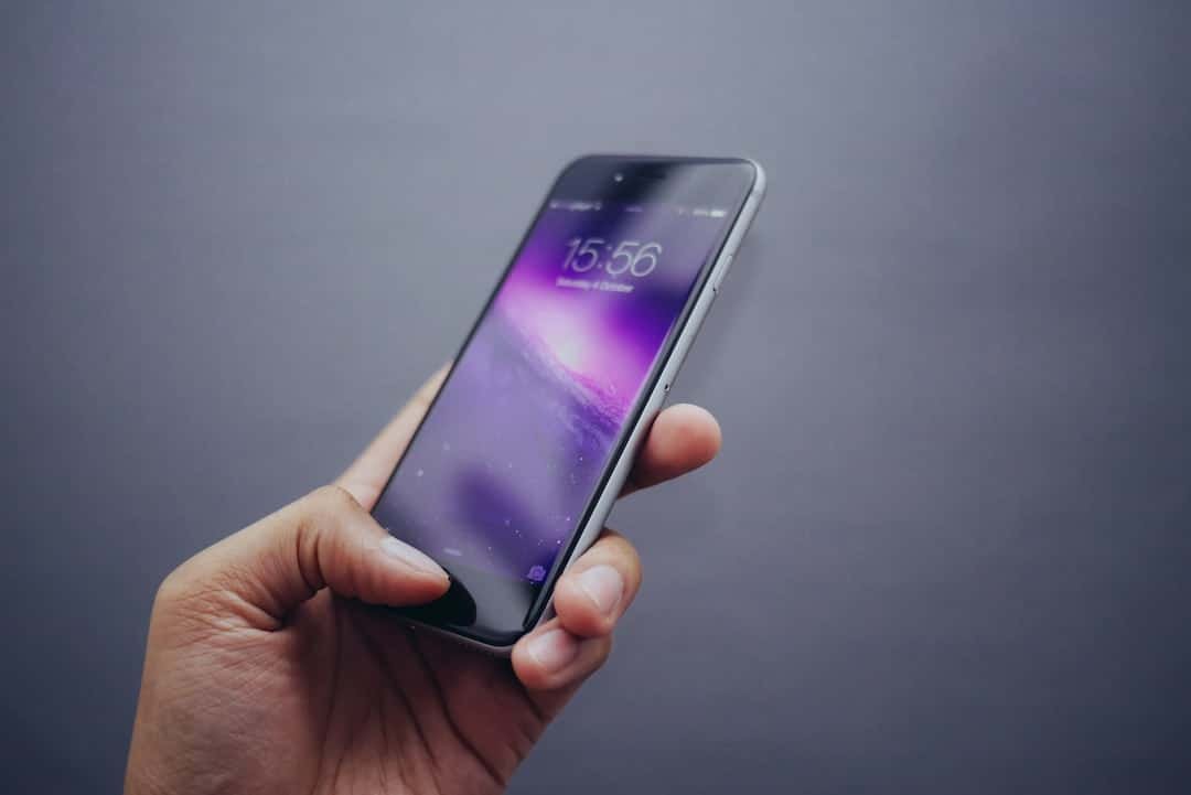Smartphone lock screen close-up, representing Apple's iOS 27 update with a rebuilt Siri