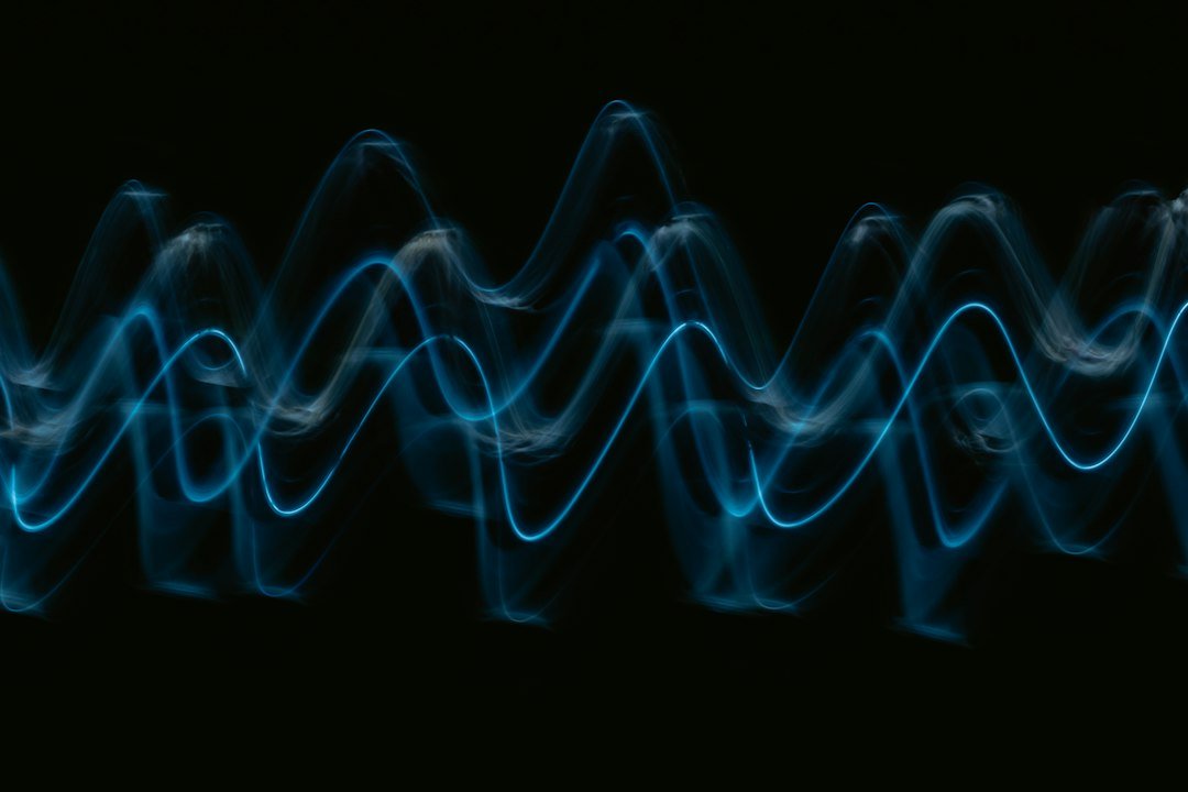 Blue wave of light representing AI voice synthesis technology