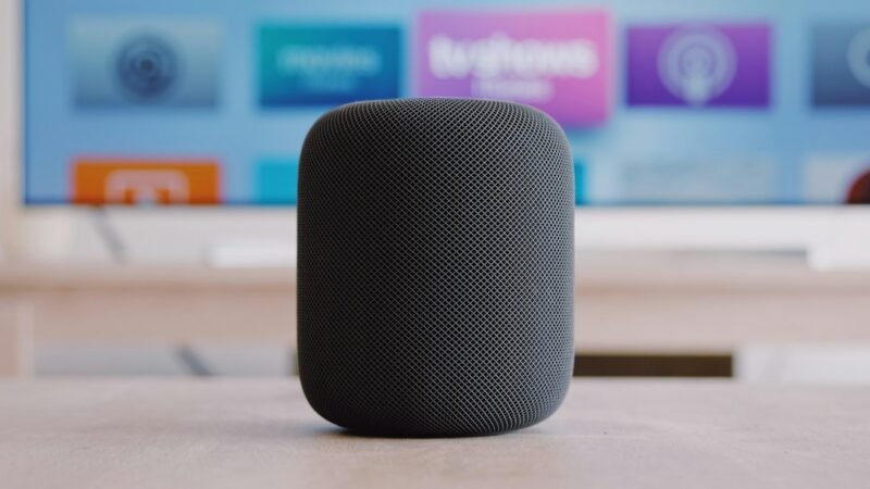 Apple HomePod smart speaker on a table in a home setting