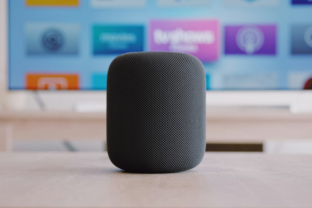 Apple HomePod smart speaker on a table in a home setting