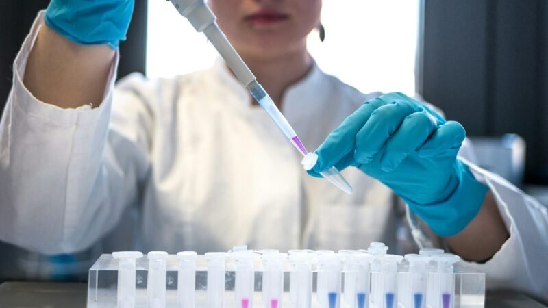 Scientist working in a laboratory, representing the best AI tools for science research
