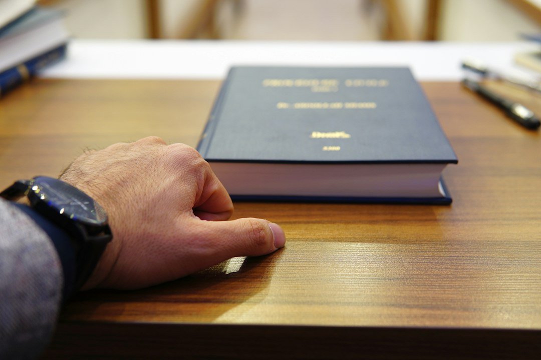 Lawyer reviewing documents with law books on the desk, representing legal AI software for law firms