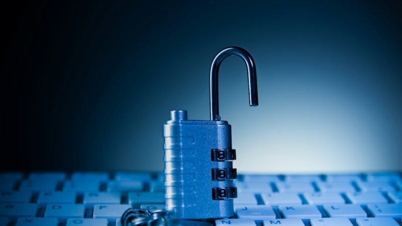Padlock resting on a computer keyboard, representing the Binance cybersecurity breach