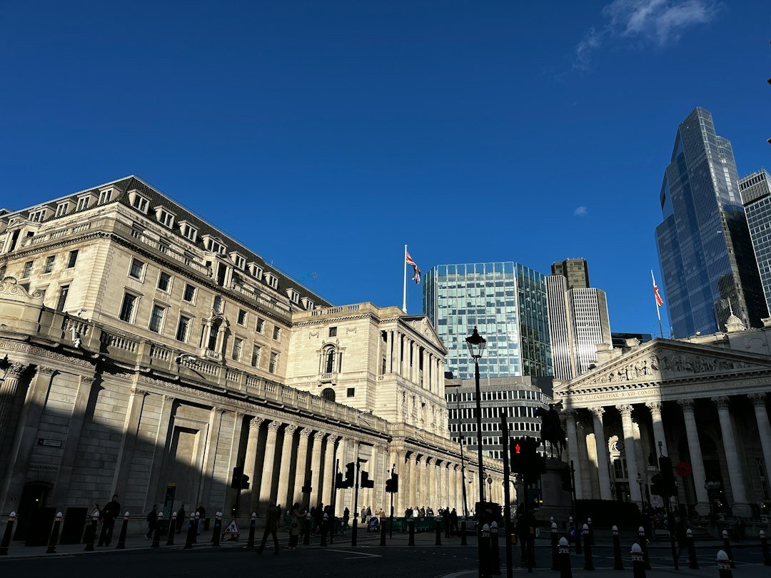 Business district buildings against a blue sky, representing corporate infrastructure financing