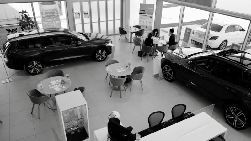Customers inside a car at a dealership