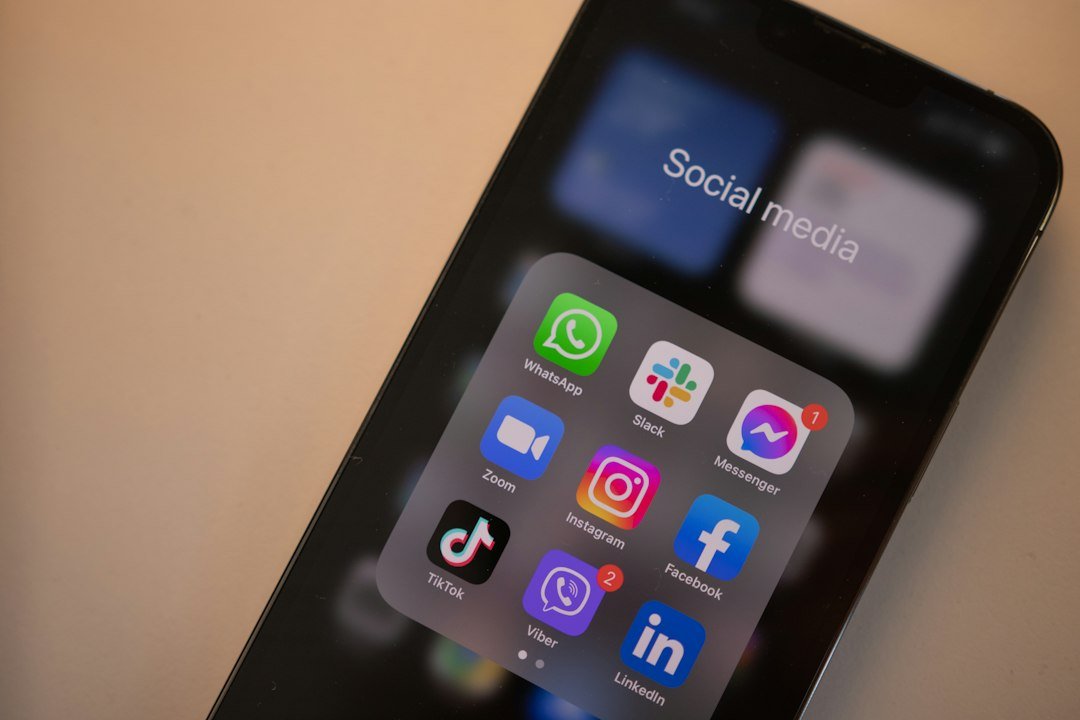 Smartphone used to check friend emojis in a messaging app chat list