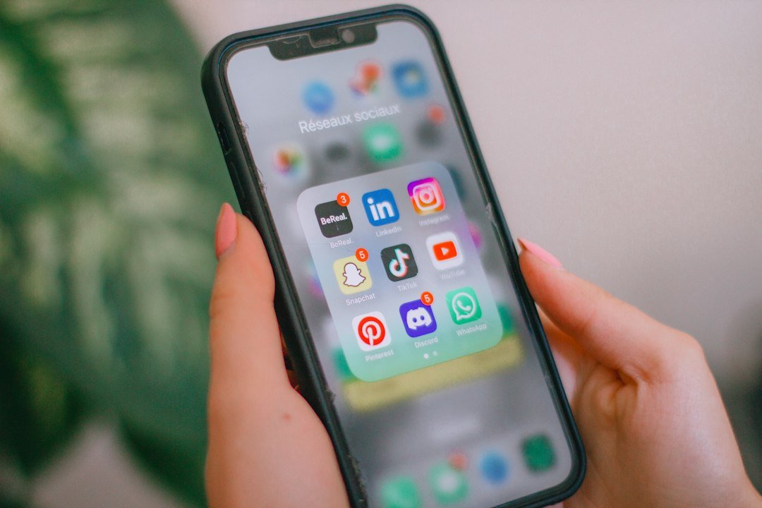 Person holding a phone and checking who their best friend is on a social app