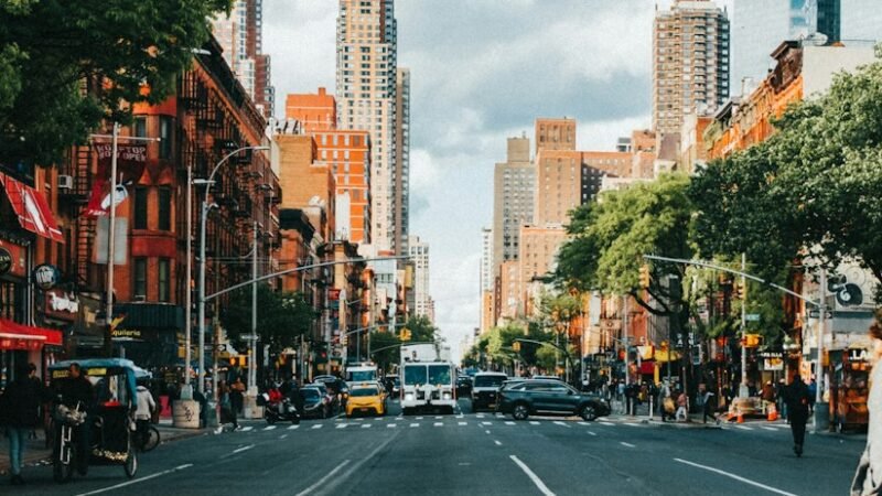City street lined with tall buildings representing a dense urban mesh network environment