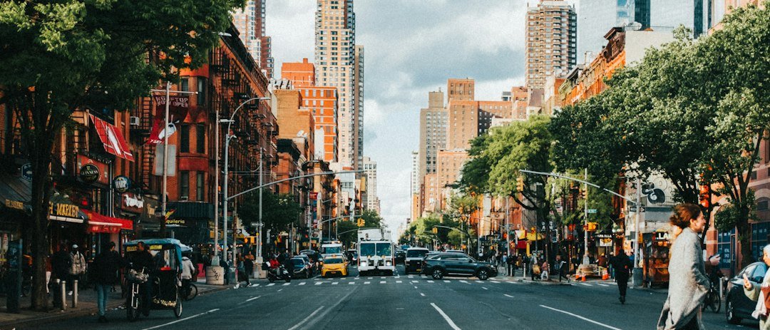 City street lined with tall buildings representing a dense urban mesh network environment